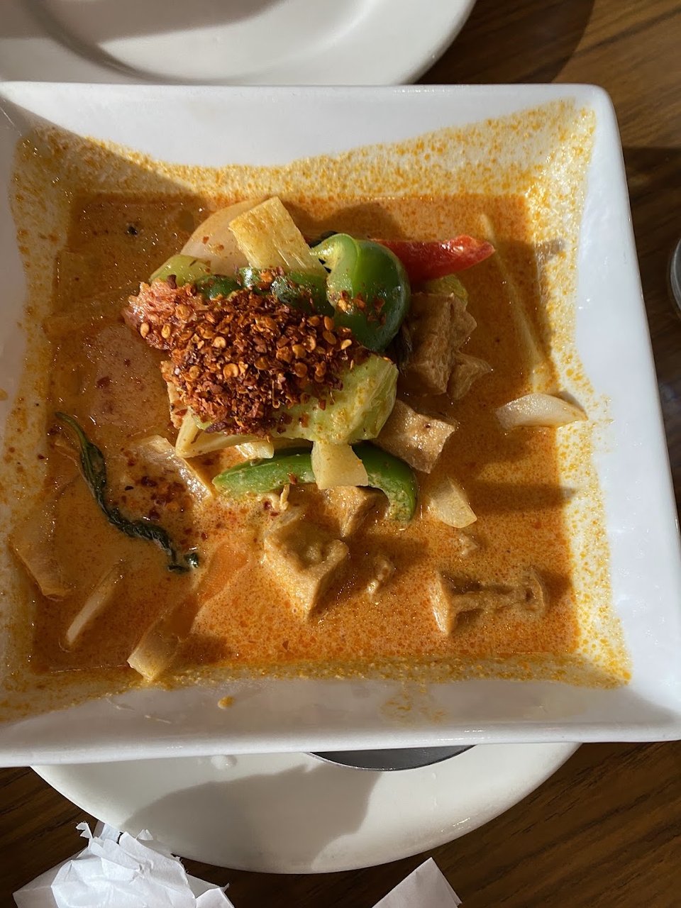 Printed menu with curry, salads, and stir-fried dishes.