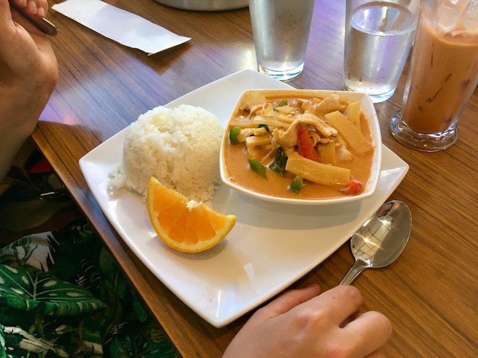 Thai menu layout with appetizer and curry sections.