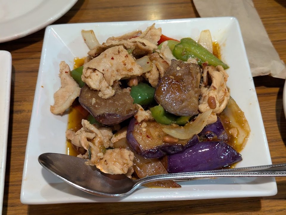 Printed menu with curry, salads, and stir-fried dishes.