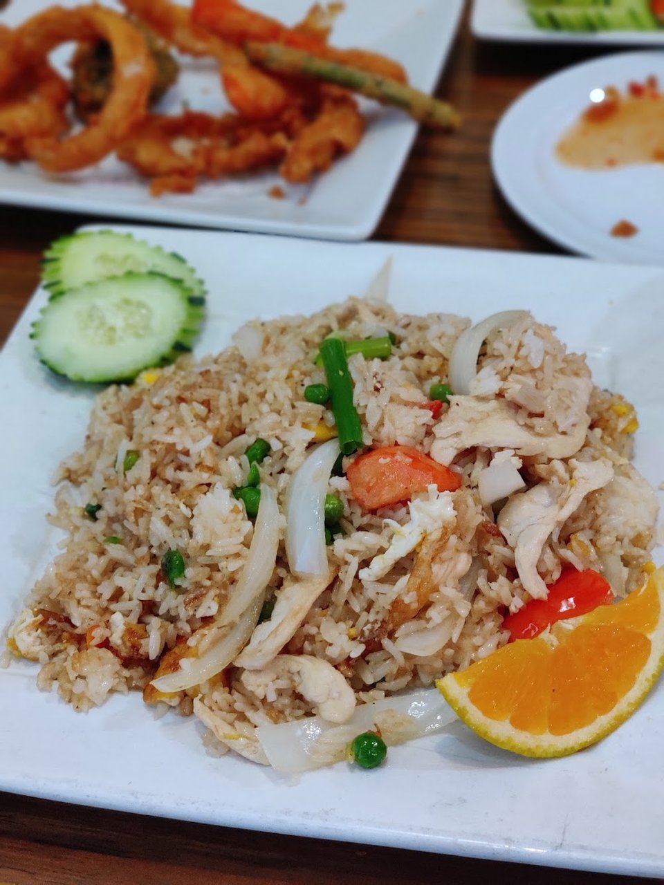 Thai menu layout with appetizer and curry sections.