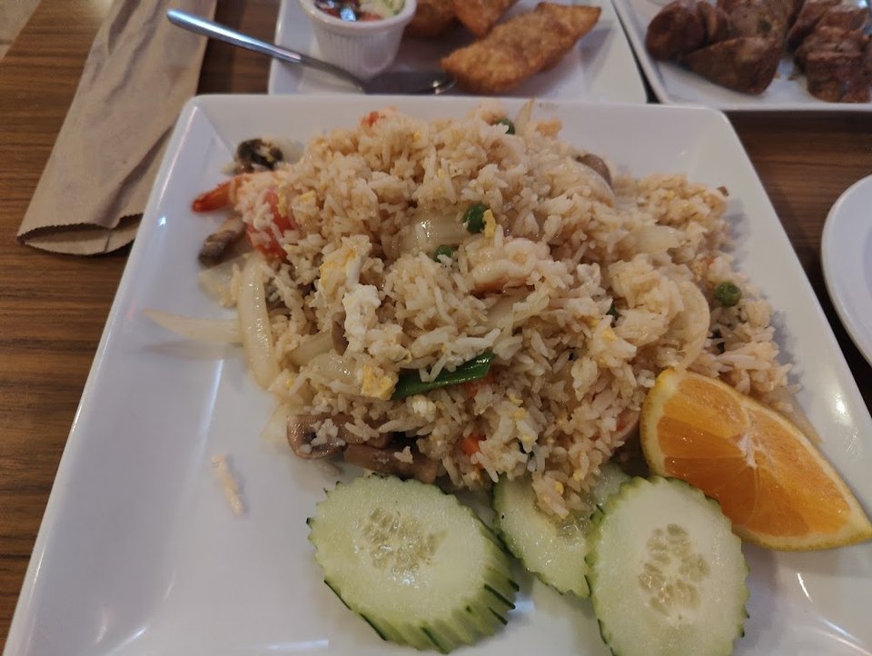Printed menu with curry, salads, and stir-fried dishes.